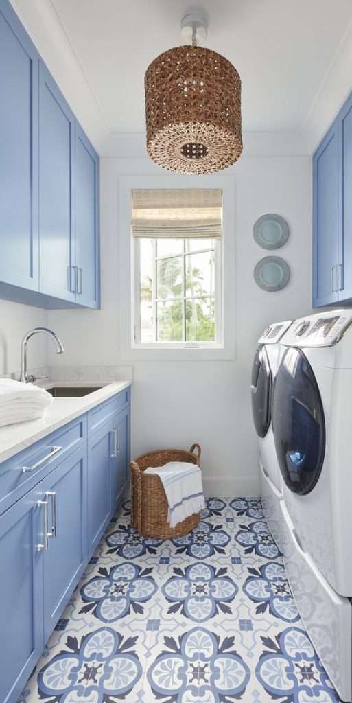 blue laundry room with blue tiled floor