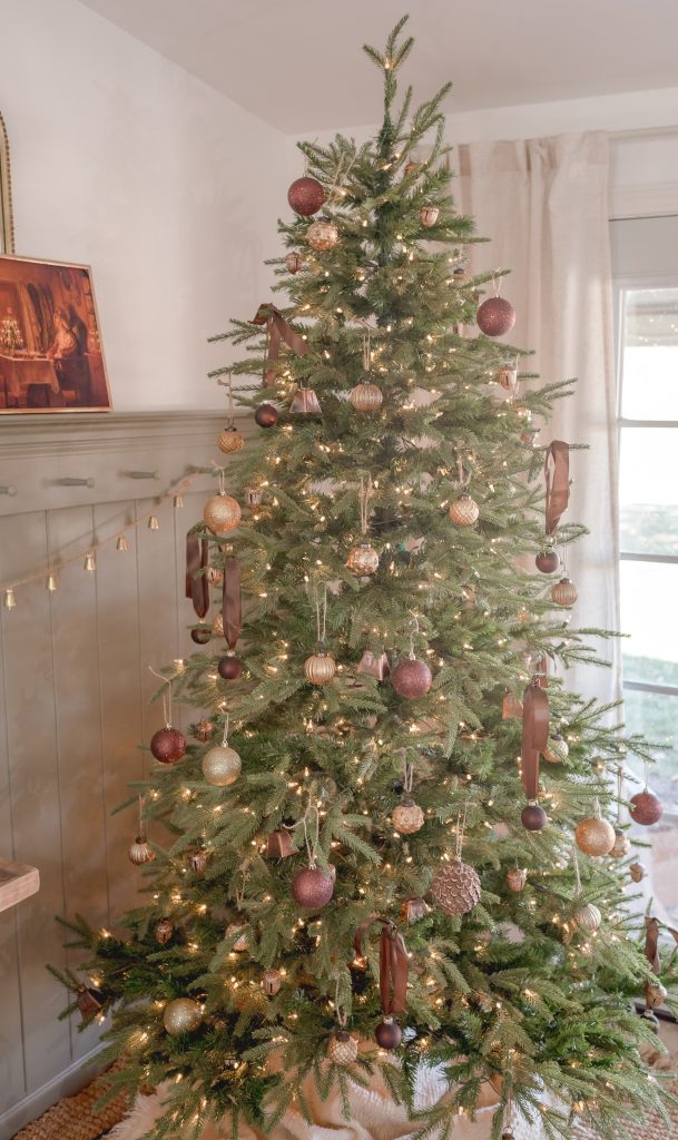 christmas tree in modern farmhouse room with art and mirror