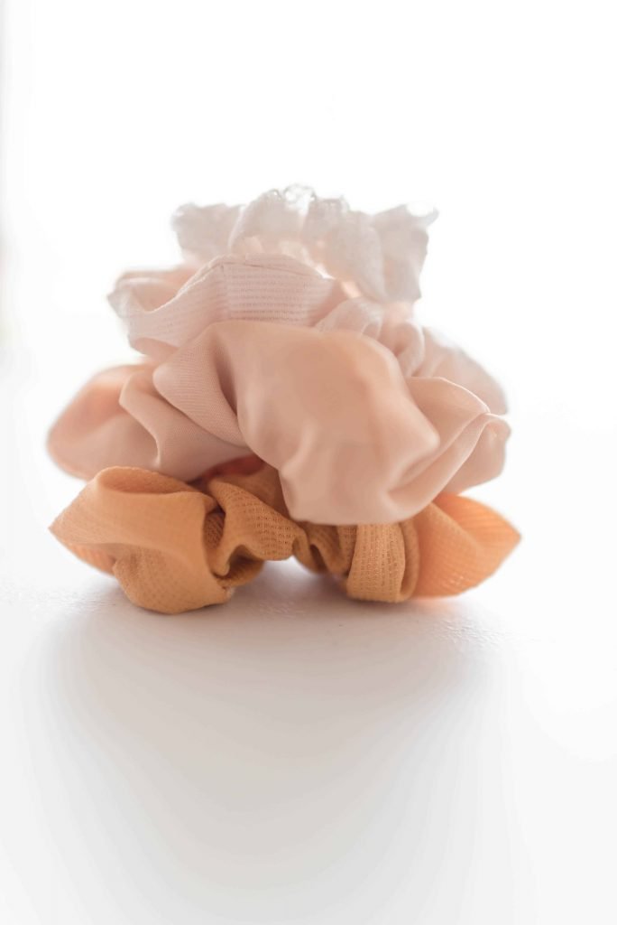 mustard, pink, mauve, white scrunchie in pile